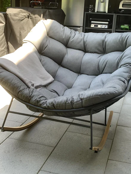 Customer photo — rocking chair on a covered terrace