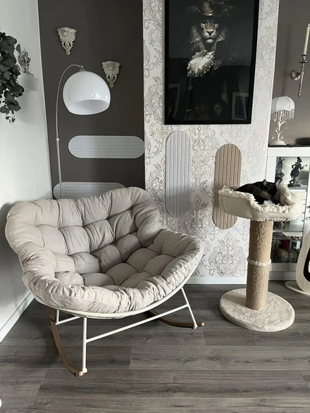 Customer photo — rocking chair beside oak flooring
